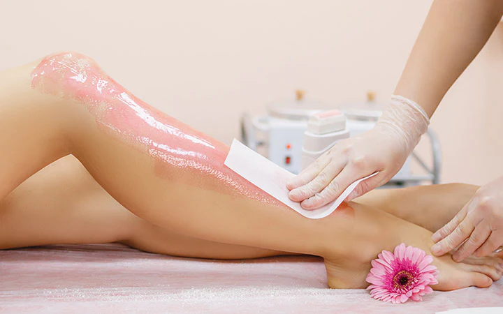 Applying-wax-to-a-young-woman_s-leg-for-hair-removal_1024x1024.webp